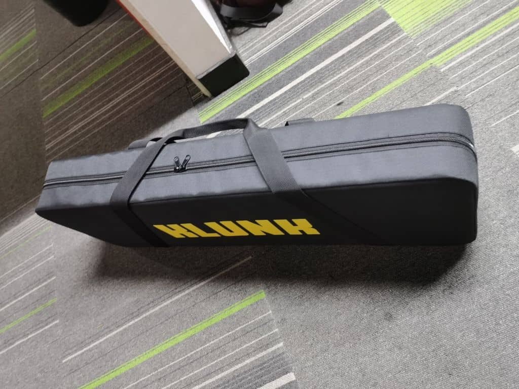 The KLUNK in its branded carry case — the full fitting kit, ready to go